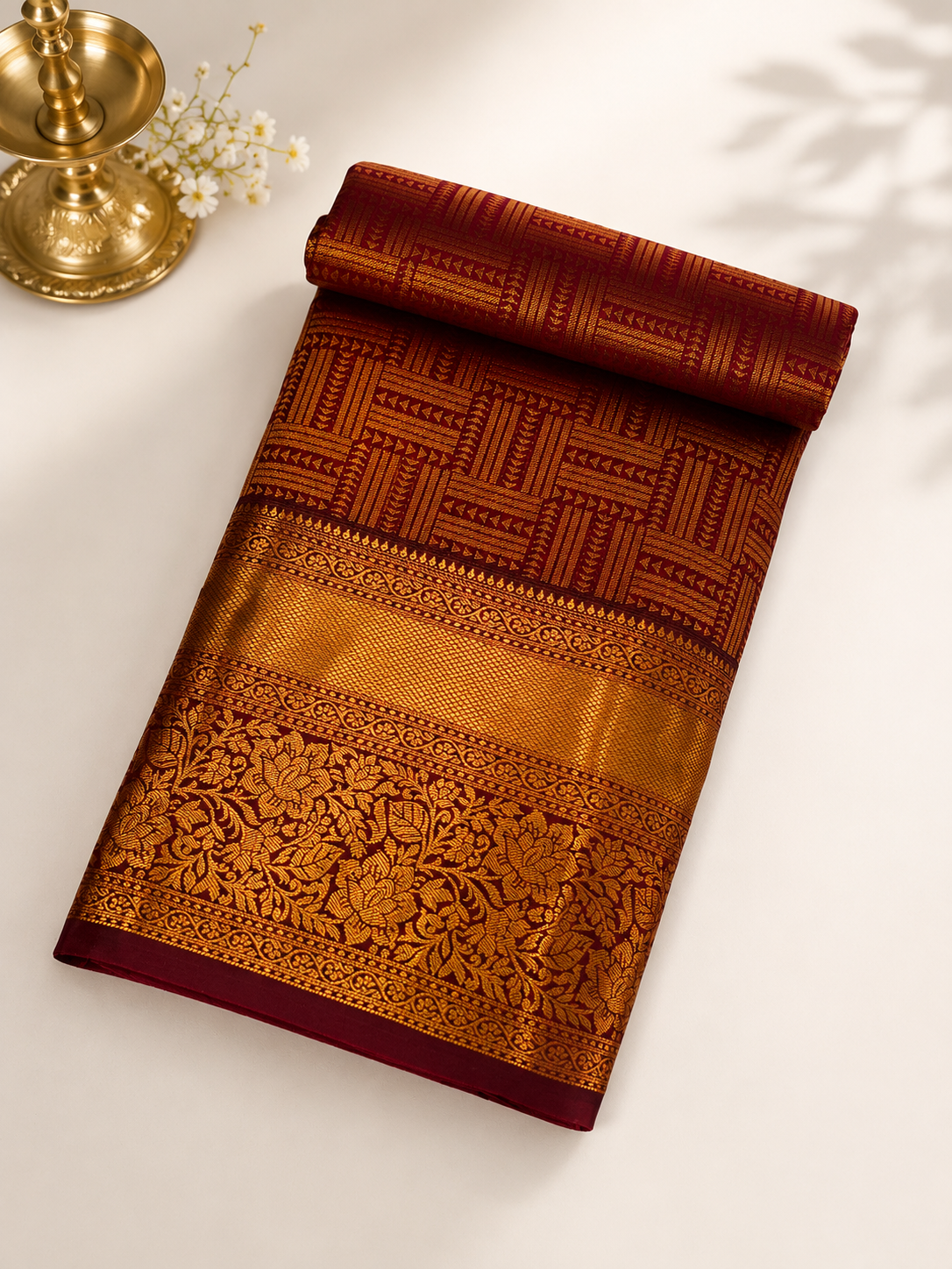 Varnika Crimson Kanjipuram Silk Saree with All-Over Gold Zari Geometric Weave and Floral Border